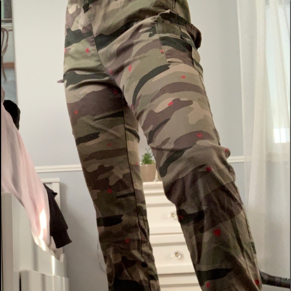 Camouflage pants with red hearts